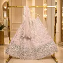 Women's Blush Pink Bridal Lehenga Choli with Silver Embroidery and Matching Net Dupatta