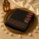 Elegant Black Saree with Floral Embroidery and Zari Detailing 